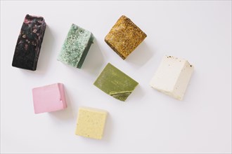 High angle view colorful soap bars white surface