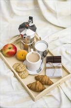 High angle view healthy breakfast messy bedsheet