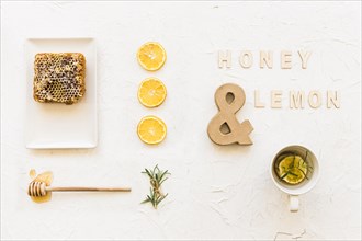 Honey lemon tea with honeycomb lemon slices rosemary