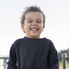Little boy outdoors smiling 4