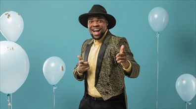 Man suit sunglasses party with balloons pointing