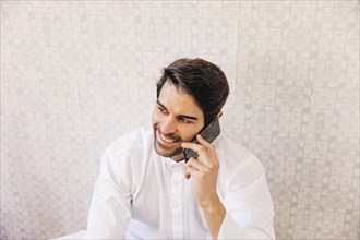 Muslim man making phone call