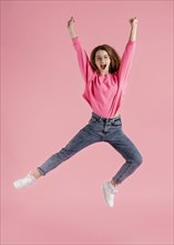 Portrait happy woman jumping