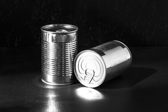 Silver tall round tin cans