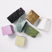 Top view colorful soap bars white backdrop