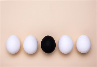 Top view different colored eggs black lives matter movement with copy space