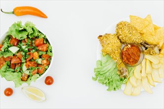 Top view fried chicken vs salad