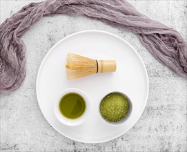 Top view matcha tea with bamboo whisk