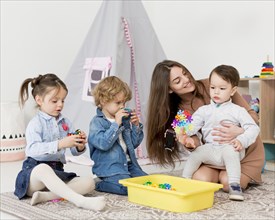 Woman playing home with children toys