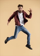 Young handsome man jumping 2
