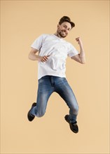 Young handsome man jumping 6