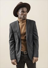 Young handsome man posing with hat 2