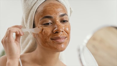 Young woman applying natural face mask 5