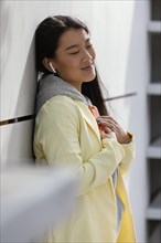 Young woman with mobile outdoor 3