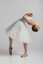 Ballerina wearing beautiful white dress full shot