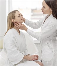 Beautician woman clinic consults client 3