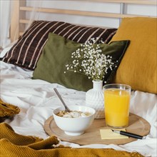 Breakfast bed with juice glass