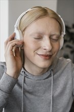 Close up smiley woman with headphones