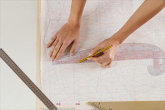 Close up woman measuring with ruler