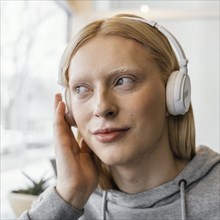 Close up woman with headphones 2