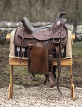 Country lifestyle with leather saddle outdoors