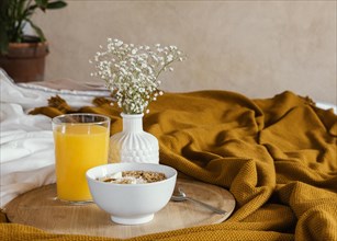 Delicious breakfast with bowl orange juice