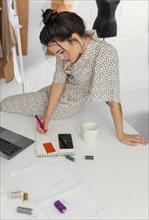 Fashion designer working her workshop 4
