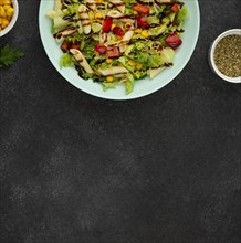 Flat lay salad with chicken balsamic vinegar with copy space