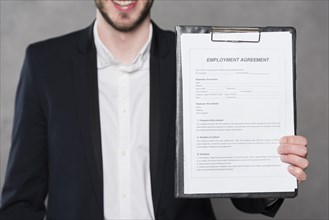 Front view man holding contract new job