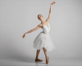 Full shot ballerina wearing beautiful white dress