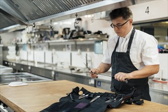 Male chef kitchen preparing his tools