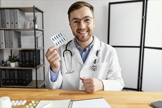 Medium shot doctor holding pills blister