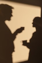 Silhouettes man woman having date home 2