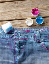 Top view colored jeans with paint