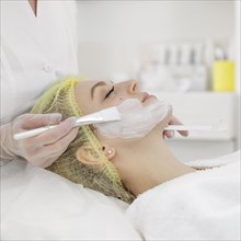 Woman beauty clinic face treatment 11