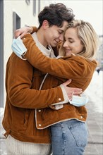 Young couple outdoor hugging 5
