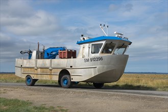 Amphibious vehicle on the road on the way to the mussel harvest