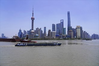 View of the skyline from the Bund on the Huangpu River with Oriental Pearl Tower