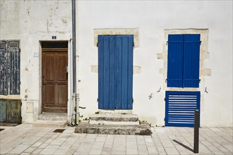 Colourful old doors and shutters in Le Chateau-d'Oleron