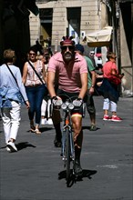 Racing cyclist with historical outfit of the Eroica in Siena