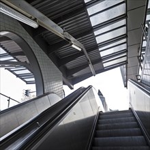 Escalator underground station Bockenheimer Warte with the top of the Messeturm