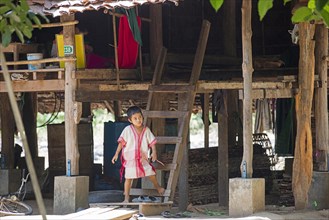 Bamar child in front of pile dwelling in Kayin village near the town of Hpa-an