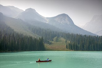 Tourists in red canoe on Emerald Lake