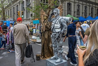 Two living statues performing at Sunday market