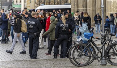 Police officers talking to cyclists