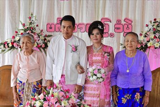 Bridal couple with relatives