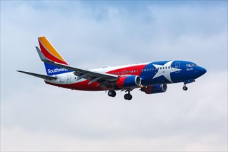 A Boeing 737-700 aircraft of Southwest Airlines with the registration number N931WN in the Lone Star special livery at Dallas Airport