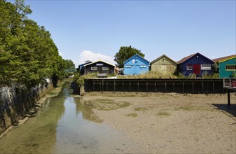 Colourful houses at low tide in Le Chateau-d'Oleron