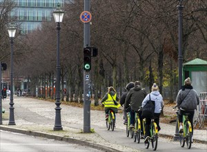 Tourists travelling with a rental bike in Berlin