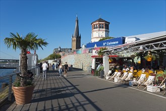 Rhine promenade with St Lambert's Basilica and castle tower